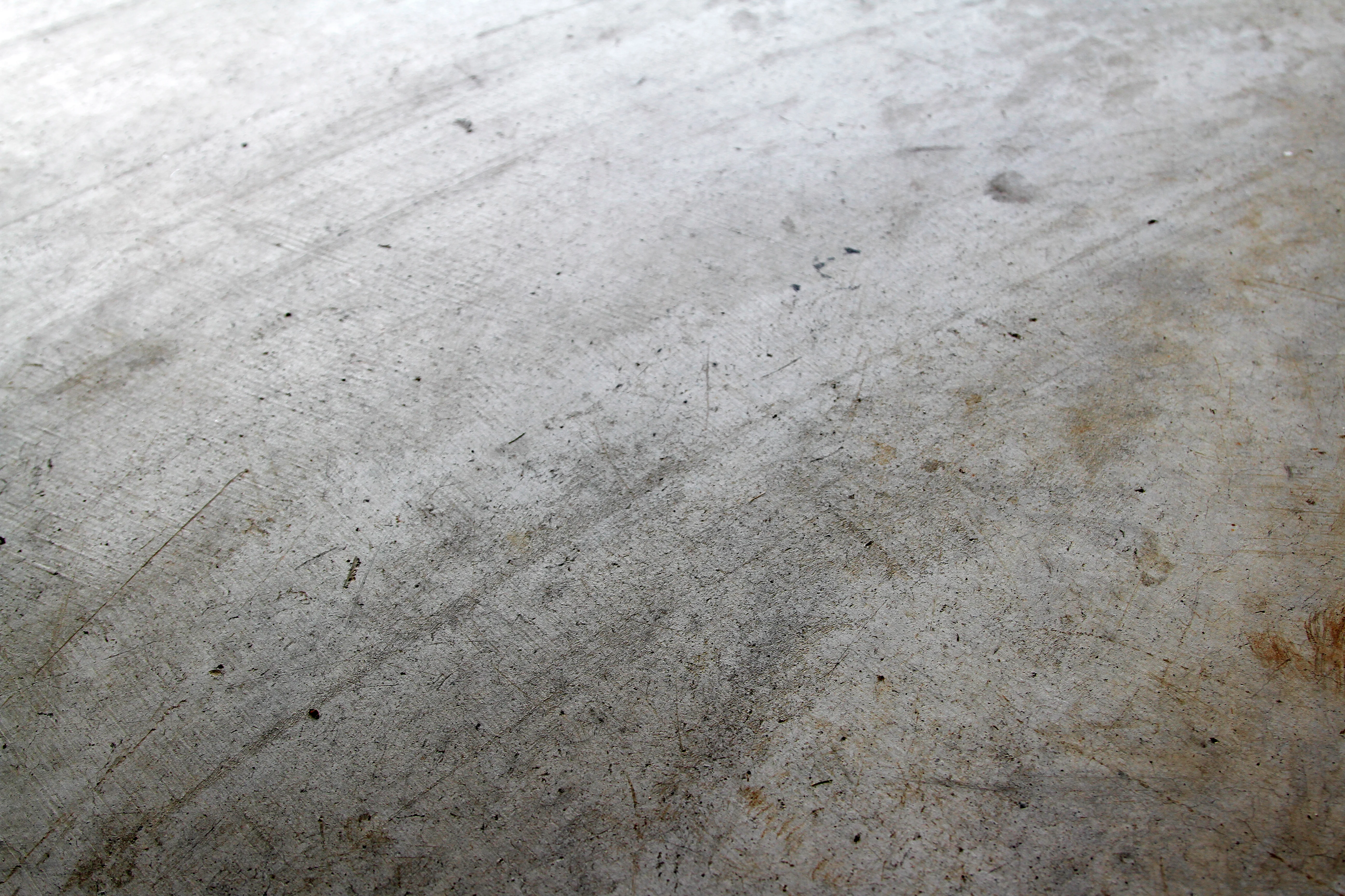 Before photo of worn concrete floor